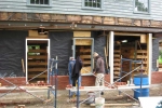 East wall with double wythe brick wall and repaired door and window frames